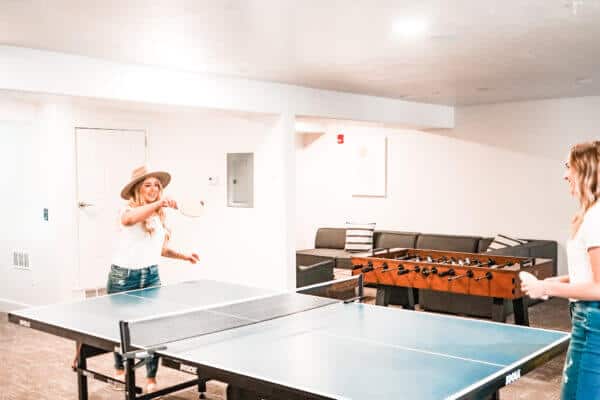 two girls playing ping pong