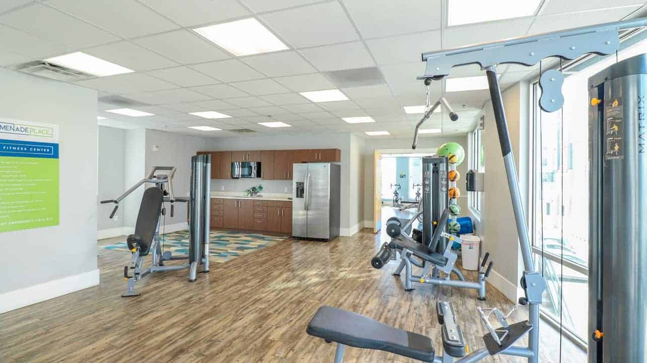 Gym equipment and kitchen area
